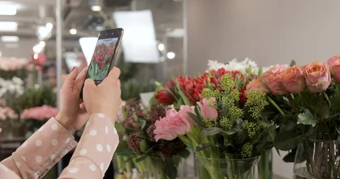 Owner Of Flower Studio Is Ordering Flowers With Mobile Phone Stock Footage 124554102
