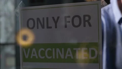 The owner of a place or store posts an ad on the glass Stock Footage 166800223