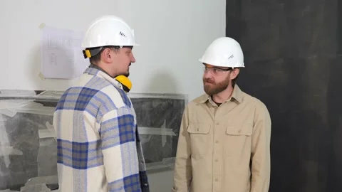 The owner of the premises and the developer shake hands on the construction site Stock Footage 236762124