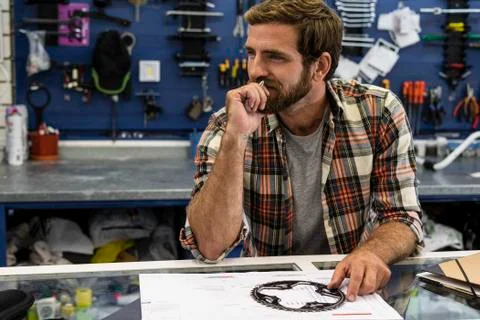 Owner sitting in workshop Stock Photos