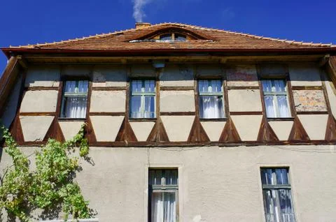Ox-eye in the wall of a half-timbered building Stock Photos