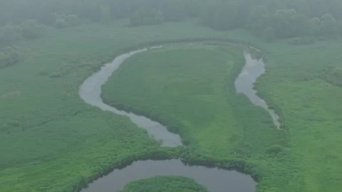 Oxbow Lake Meander – High Sideways Left Telephoto Aerial Establishing Flight Stock Footage 336500358