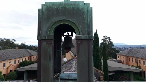 Oxidized copper bell tower on a cloudy day Stockbeeldmateriaal 336715035