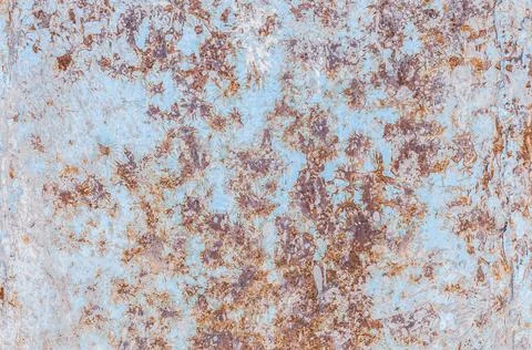 Oxidized rough texture, brown rust with peeling blue paint. Rusty metal surfa Stock Photos