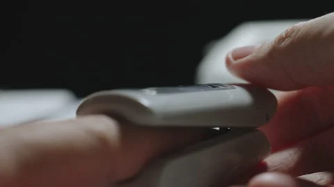 Oximeter. Man using digital device to monitor an oxygen level. Closeup. Stock Footage 159943359