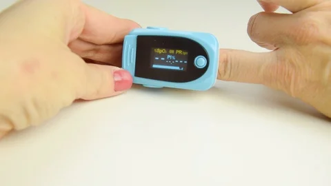Oximeter measures saturation Stock Footage 119772093