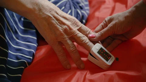 Oximeter. A person's pulse is measured using a portable device. Video stock 155817463