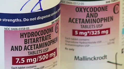 Oxycodone and hydrocodone pill bottles Stock Footage 24773104