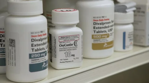 OxyContin Bottle on Pharmacy Shelf Stock Footage 301886062