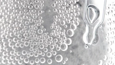 Oxygen bubbles in clear transparent water with hyaluronic acid gel Stock-Footage 158740953