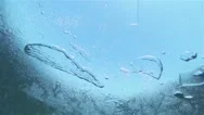 Oxygen Bubbles Move Under The Ice In Slow Motion Stock Footage