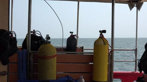 Oxygen cylinders for diving on scientific ship on background of cargo ship Stock Footage