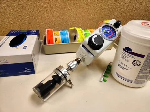 Oxygen flow meter with labels, gloves, wipes Stock Photos