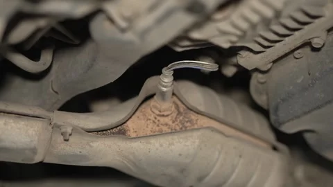 An oxygen sensor (lambda sensor) installed in a car Stock Footage 340978122