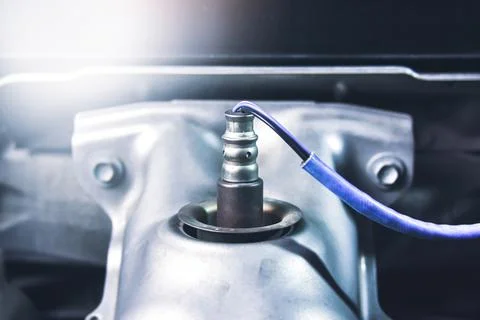 Oxygen sensor O2 on the header exhaust pipe Stock Photos