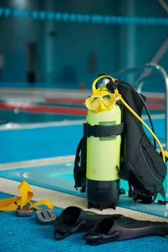 An oxygen tank at poolside, diving equipment Stock Photos