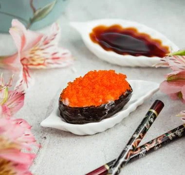 Oyster with red caviar on the table Stock Photos