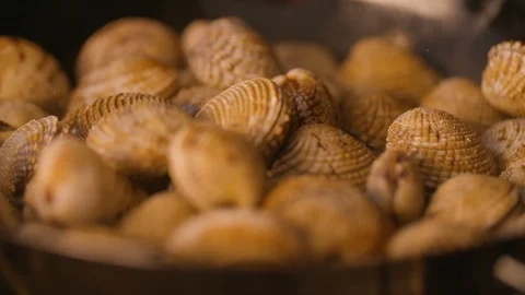 Oyster shells cooked in the frying pan Stock Footage 85812790