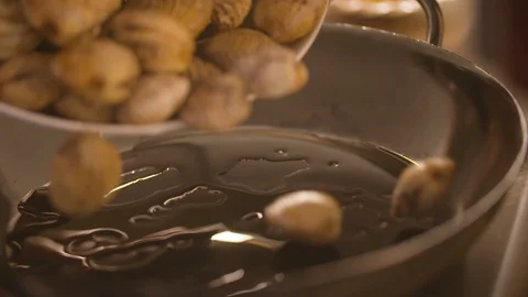 Oyster shells put in the frying pan Stock Footage 85812775