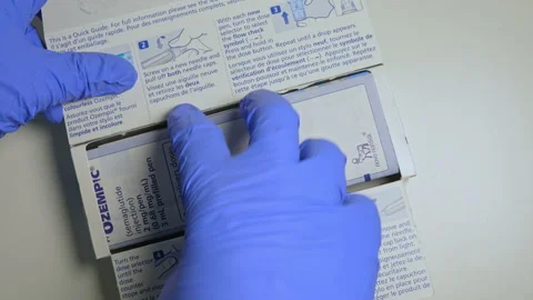 Ozempic Injection box package and pen closeup display with instructions. Oz.. Stock Footage 320085951