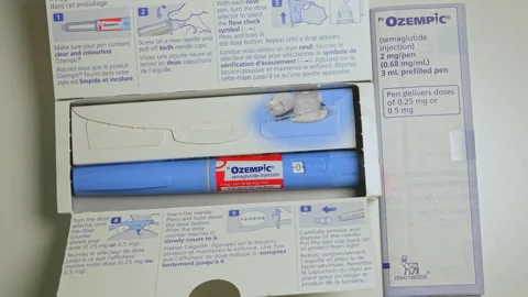 Ozempic Injection box package and pen closeup display with instructions. Oz.. Stock Footage 320087274