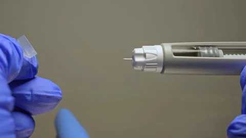 Ozempic Injector pen dosage of the medication, macro close up. Liquid drug .. Stock Footage 320086901