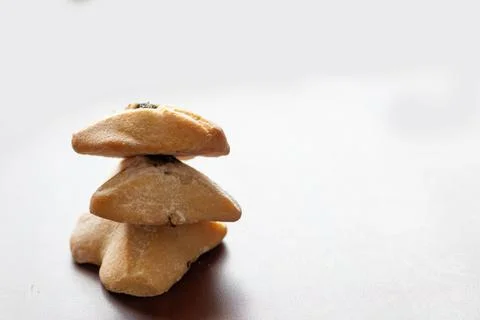 Ozney haman (Haman Ear) Triangular pastry made of crispy dough stuffed. Tradi Stock Photos