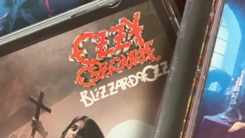 Ozzy Osbourne - CDs - CU - Table top - July 23, 2025 - Bettendorf, IA Stock Footage 313622747