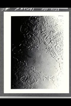 P-34668 This narrow angled image of Neptune s Triton, part of a sequence r... Stock Photos