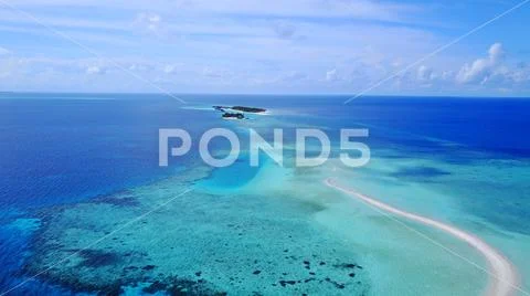 P02257 Aerial flying drone view of Maldives white sandy beach on sunny tropical Stock Photos