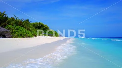 P02393 Aerial flying drone view of Maldives white sandy beach on sunny tropical Stock Photos