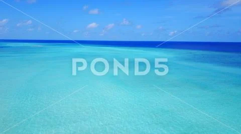 P02397 Aerial flying drone view of Maldives white sandy beach on sunny tropical Stock Photos