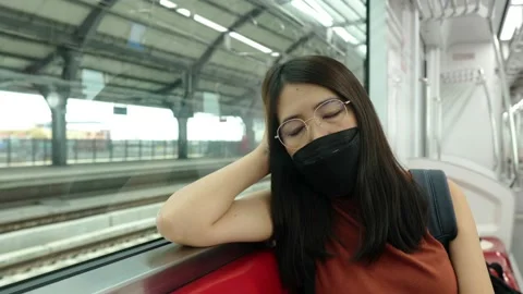 P103Asian woman sleeping or nap on train,Safety on public transport Stock Footage