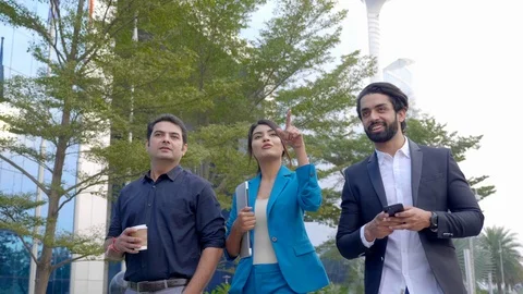 P1088111  Three happy Indian office executives outside . Stock Footage 122489853