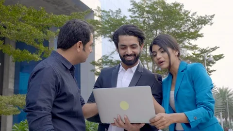 P1088113 Three Indian office executives interacting with each other. Stock Footage 122490657