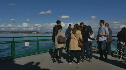 P1090087-Group tourists take photos as ferry departs Seattle Stock Footage