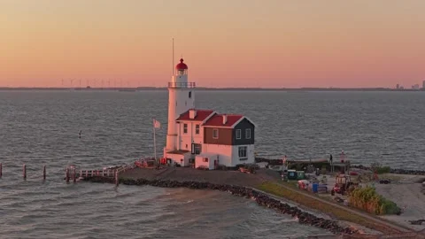 Paard van marken lighthouse glowing during a beautiful sunset Stock Footage 342813532