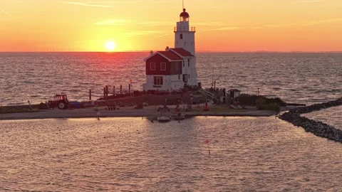 Paard van marken lighthouse standing in the sea during sunset Stock Footage 342813484