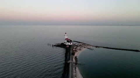 Paard van Marken, lighthouse at sun set along the water in the Netherlands Stock Footage 150207485