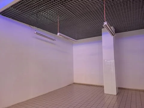 Pace for rent in hypermarket. Empty store or warehouse Stock Photos