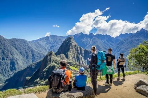 Pachu Picchu, Peru - May 2, 2019. Seveal Travelers  Looking at the Inca ruins Stock Photos