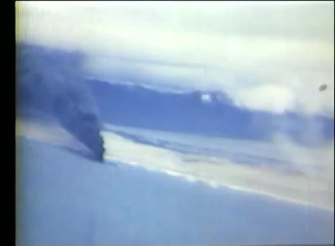 PACIFIC - 1939: Strike run - A bright burst throws spray on the sea Stock Footage 343931259