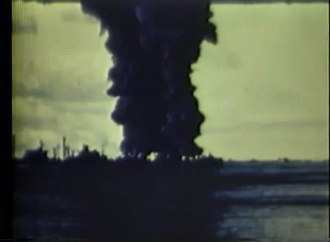 PACIFIC - 1943: Ship fire - Black smoke towers over the anchorage Stock Footage 343931705