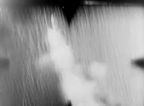 PACIFIC - 1944: Aerial fire patterns - Smoke bursts surround faint tracers Stock Footage 344507880