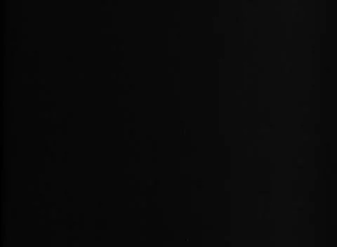 PACIFIC - 1944: Light specks - Dark frames reveal no identifiable subject Stock Footage 344487913