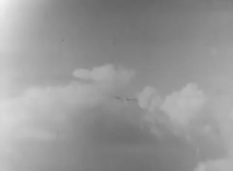 PACIFIC - 1944: Naval combat impact - Explosion cloud blooms over water Stock Footage 344507892