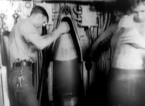PACIFIC - 1944: Naval gun crew - Shirtless sailors handle heavy shells Vidéo 344507996