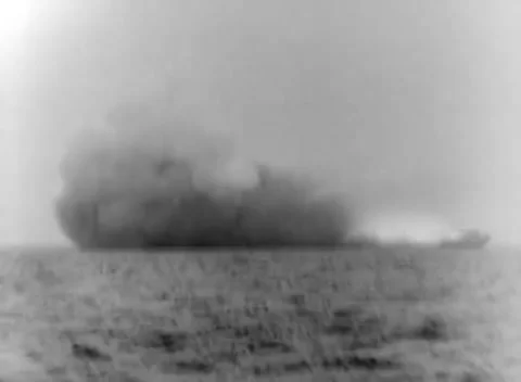 PACIFIC - 1944: Surface bombardment - Shell splash climbs above ocean Stockbeeldmateriaal 344508053