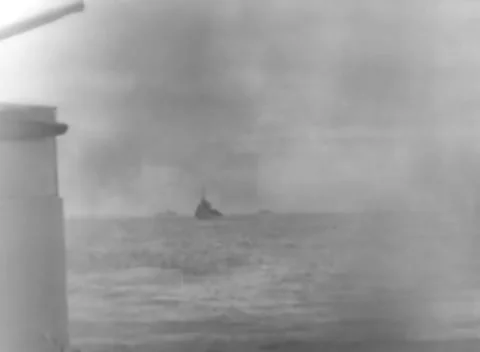 PACIFIC - 1944: Task force underway - Smokestack frames distant ships Stock Footage 344507925
