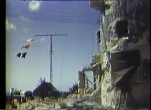 PACIFIC - 1945: Airfield control - A man works hand flags atop the tower Stock Footage 343931966